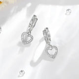 Sofistikerade Guld Zircon Hängande Örhängen med Kärleksdroppe